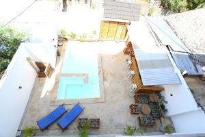 an aerial view of a house with a swimming pool at IMARA VILLA 
