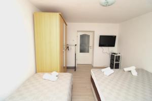 Postel nebo postele na pokoji v ubytování Apartman Elez