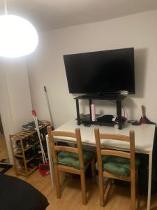 a desk with a television on top of it at Inviting 1-Bed Studio in London in London