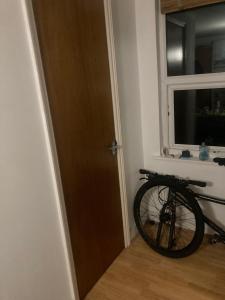 a bike parked in a room next to a door at Inviting 1-Bed Studio in London in London