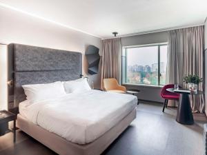Posteľ alebo postele v izbe v ubytovaní Pullman Santiago Vitacura