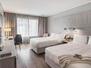 Posteľ alebo postele v izbe v ubytovaní Pullman Santiago Vitacura