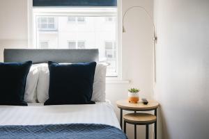 a bedroom with a bed and a window at CitySpace Borough in London