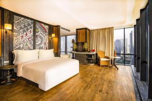 Voodi või voodid majutusasutuse The Orient Jakarta, a Royal Hideaway Hotel toas