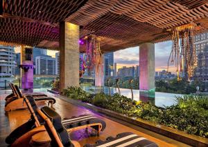 a hotel lobby with a view of the city at The Orient Jakarta, a Royal Hideaway Hotel in Jakarta