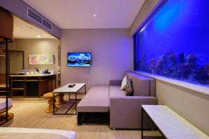 TV i/ili multimedijalni sistem u objektu Hotel H2O