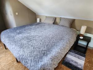 Postel nebo postele na pokoji v ubytování Le Grenier de Math