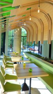 a row of tables and chairs in a building at Hotel Gergana - Ultra All Inclusive in Albena