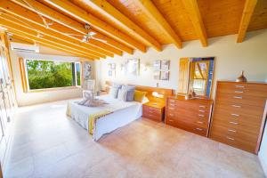 a bedroom with a bed and a large window at Finca Els Oscols 53 in Alcudia +37 photos