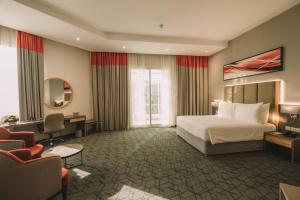 Postel nebo postele na pokoji v ubytování Peony Hotel