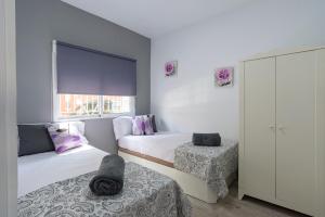 Postel nebo postele na pokoji v ubytování Fantastic & Functional apartment in Malaga II