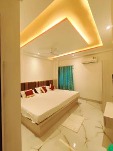 a bedroom with a bed in a room at S.S Guest House in Varanasi