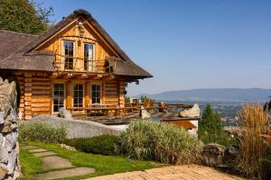 a log cabin with a porch and a deck at Chata Góralska Exclusive SPA - Lipowa Beskidy in Lipowa