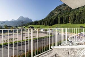 a balcony with a view of a mountain at Ariane's Guesthouse in Sesto