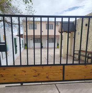 a gate in front of a building at LOS CACTUS in Malargüe