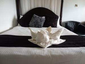 Krevet ili kreveti u jedinici u okviru objekta Balmoral Beach Hotel Kisumu