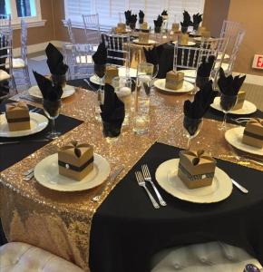 a long table with cakes and plates on it at Balmoral Beach Hotel Kisumu in Kisumu