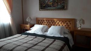 Rúm í herbergi á Hotel Mi Casa