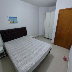 Ένα ή περισσότερα κρεβάτια σε δωμάτιο στο Residencial Ponta das Canas