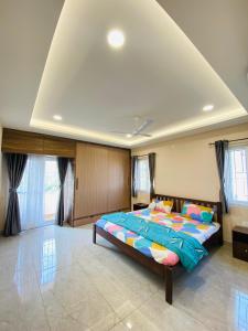 a bedroom with a large bed in a room at Swayamkrushi 4th floor in Hyderabad