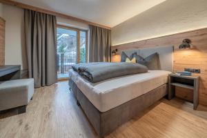 Posteľ alebo postele v izbe v ubytovaní Bergmomente Apartments