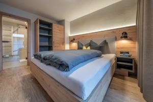 Posteľ alebo postele v izbe v ubytovaní Bergmomente Apartments