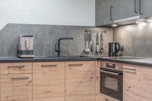 Kuchyňa alebo kuchynka v ubytovaní Bergmomente Apartments