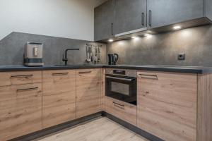 Kuchyňa alebo kuchynka v ubytovaní Bergmomente Apartments