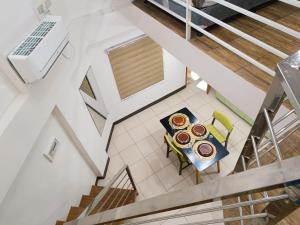 an overhead view of a dining room table with donuts on it at FB Dormitel Suites in Cagayan de Oro
