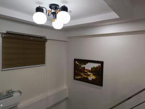 a room with a painting on the wall and a ceiling at FB Dormitel Suites in Cagayan de Oro +60 photos