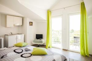 Posteľ alebo postele v izbe v ubytovaní Gabi Rooms & Studio Apartment