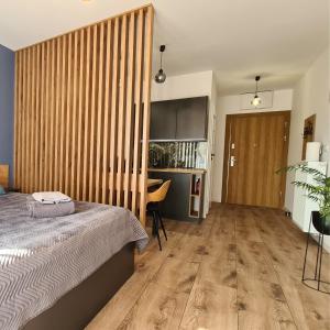 Postel nebo postele na pokoji v ubytování Apartament - Sienkiewicza 22D