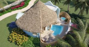 an overhead view of a resort with a swimming pool and a straw umbrella at Sandals Royal Curacao All Inclusive Couples Only in Nieuwpoort