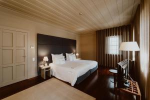 Cama ou camas em um quarto em Hotel da Oliveira