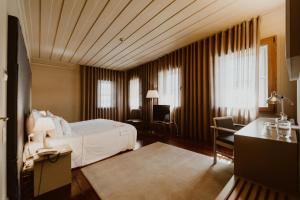 Cama ou camas em um quarto em Hotel da Oliveira