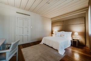 Cama ou camas em um quarto em Hotel da Oliveira
