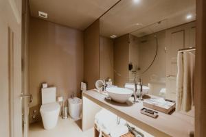Um banheiro em Hotel da Oliveira