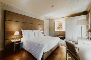 Cama ou camas em um quarto em Hotel da Oliveira