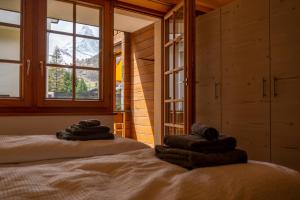 Postelja oz. postelje v sobi nastanitve Baccara Studio with Matterhorn view by Inspiring Places Zermatt