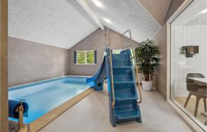 a indoor swimming pool with a slide in a house at Aqua 242 in Krakow am See