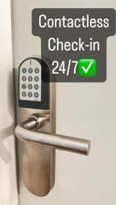 a sign that says contact check in on a bathroom door at Hotel Centro Fürth Nürnberg in Fürth