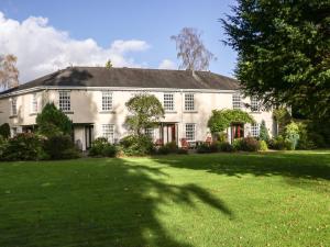 a large white house with a large yard at Lakeside View in Ulverston