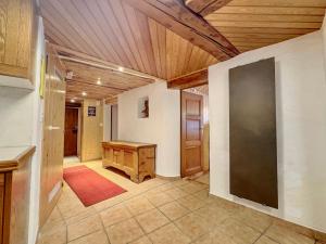 a large room with a wooden ceiling and a desk at Les Antilles l Bucolique l 6pers in Vercorin