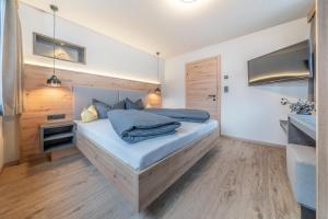 Posteľ alebo postele v izbe v ubytovaní Bergmomente Apartments