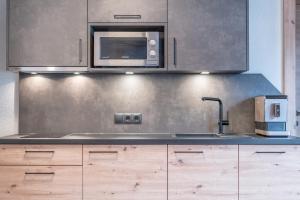 Kuchyňa alebo kuchynka v ubytovaní Bergmomente Apartments