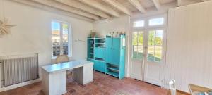 a room with a blue desk and a window at Charmante Maison dans Les Landes x 10 avec piscine et salle d escalade in Lue +67 photos