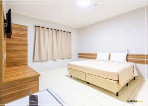 Postel nebo postele na pokoji v ubytování Gabirá Hotel