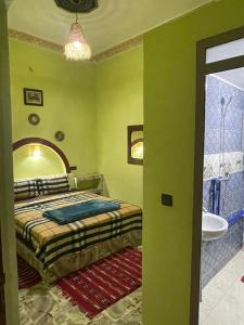 Ένα ή περισσότερα κρεβάτια σε δωμάτιο στο Appartement moha merzouga
