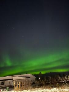 an image of the northern lights in the sky at Big apartment, near Santaclaus Village in Rovaniemi