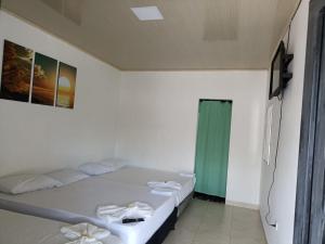 Giường trong phòng chung tại Alojamiento la esmeralda